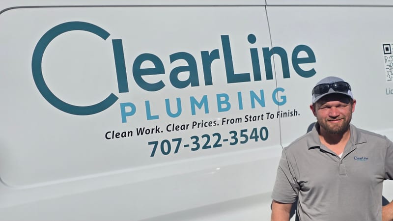 Robert Henningsen, founder of ClearLine Plumbing, in front of the company van